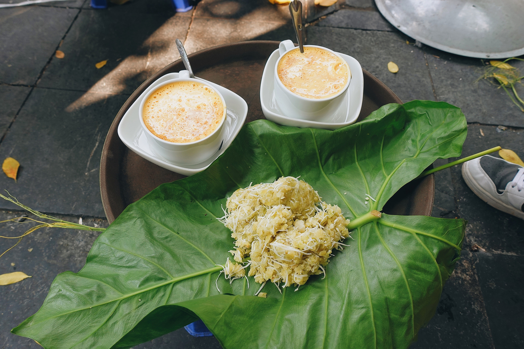 Enjoy coffe with sticky rice in front of Hanoi Cathedral