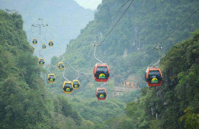 Taking cable car to Huong Tich cave