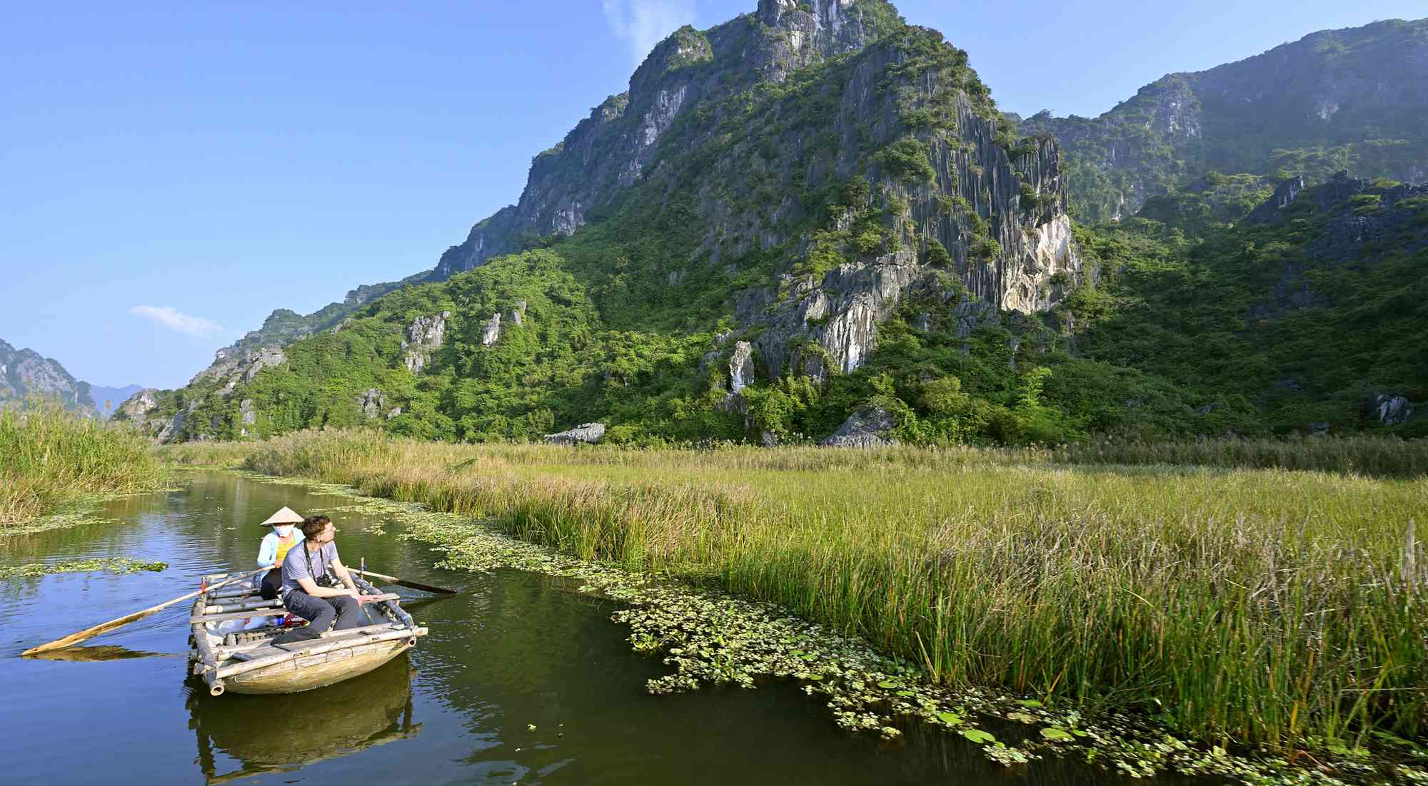 Van Long Lagoon and majestic limestone mountains