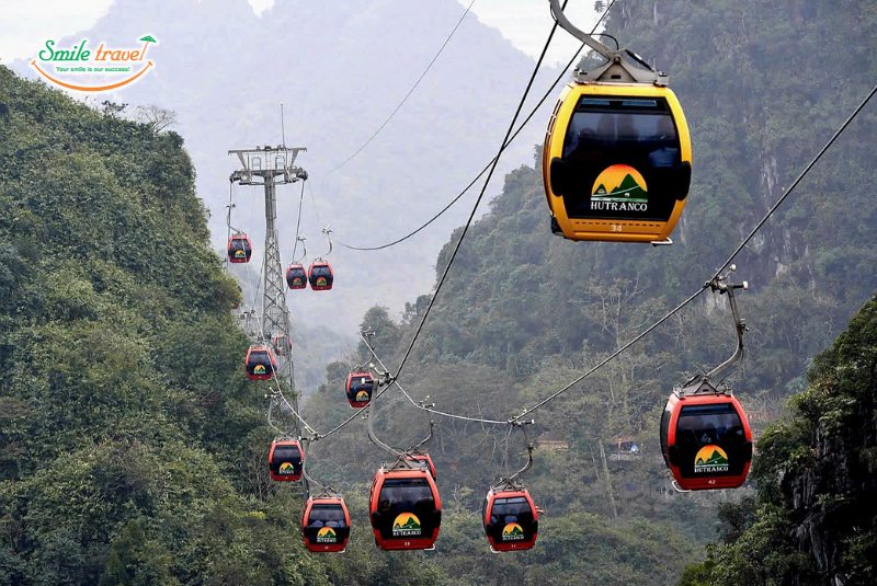 Taking cable car to Huong Tich cave